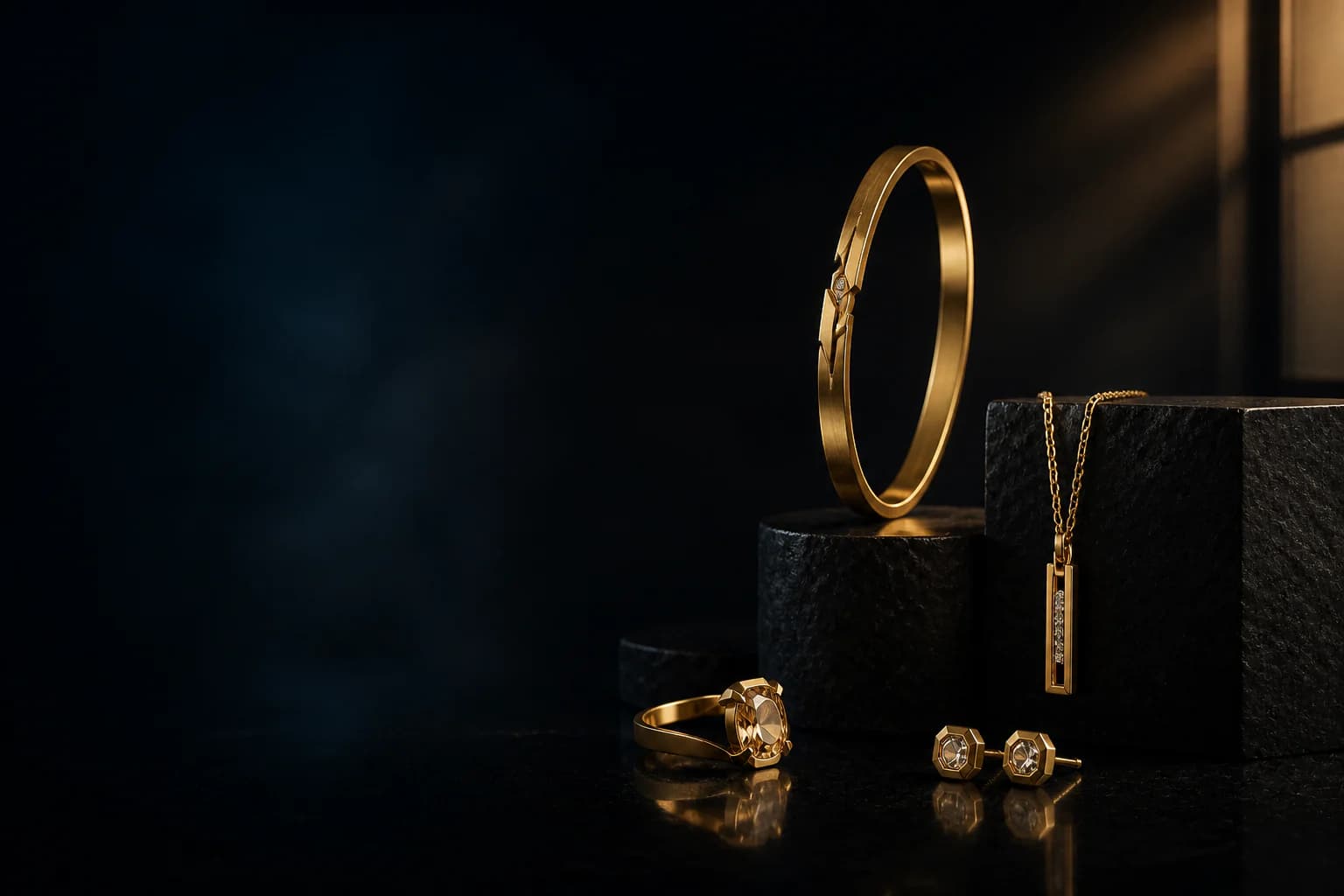 Editorial still life of original gold jewelry on black stone plinths